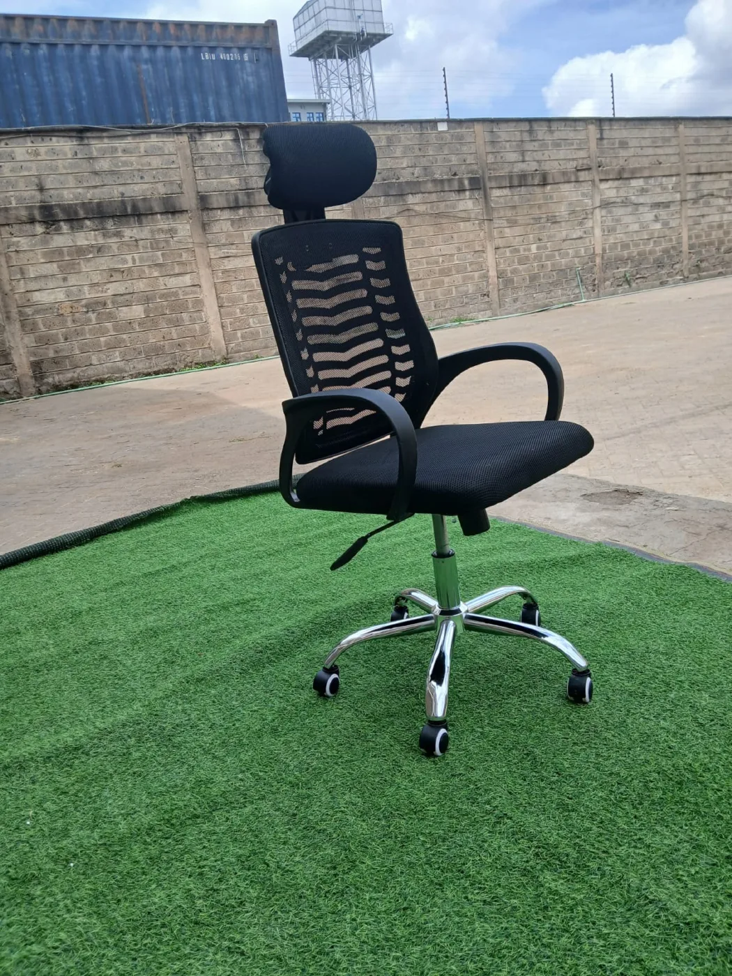 Black mesh office chair with headrest